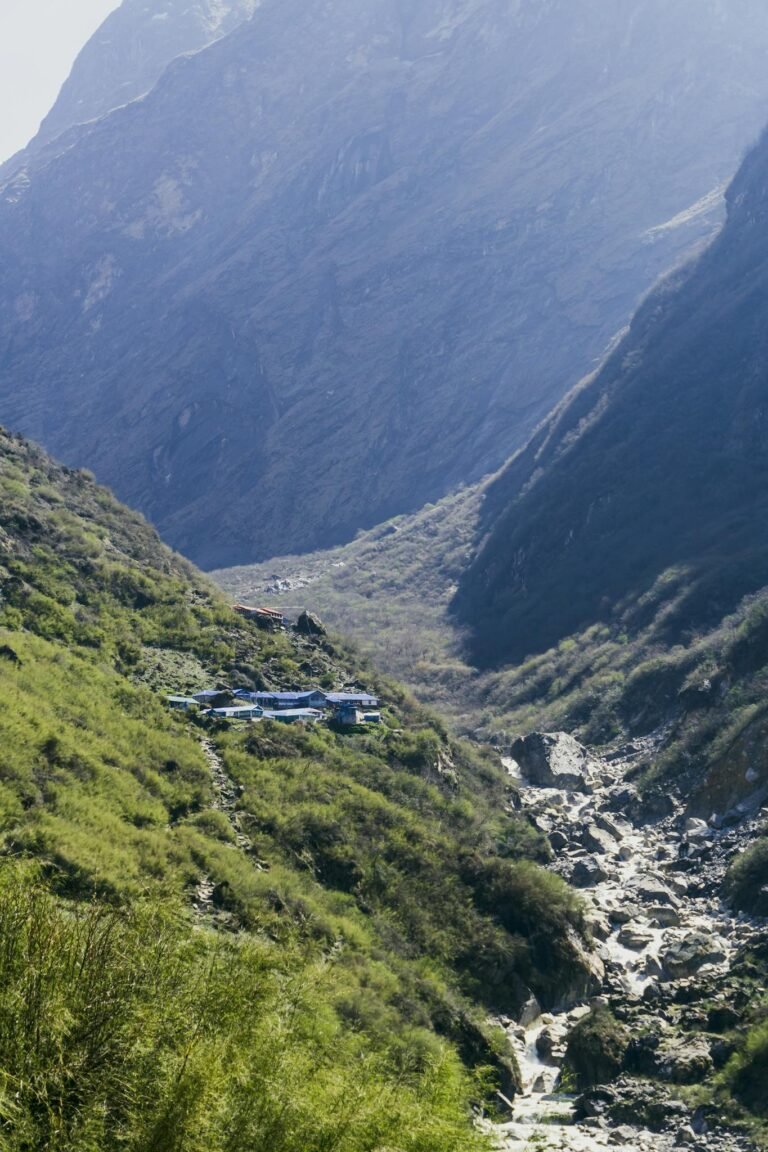 Stunning landscape of the Annapurna Valley with lush greenery and towering mountains in Nepal.