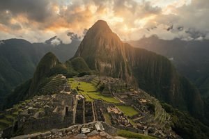 A spectacular panoramic view of the sacred Machu Picchu sanctuary from the Sun Gate, showcasing the vastness of the ancient citadel circuits.